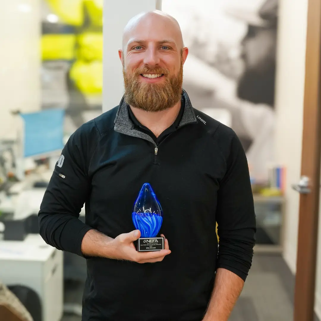 Dedicated Financial GBC team member receiving an industry award featured in company press and media